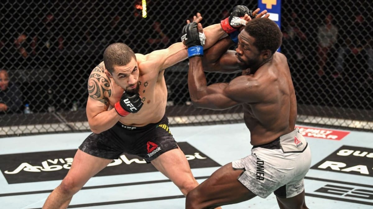 Jared Cannonier reveals Whittaker broke his forearm with the very first kick at UFC 254