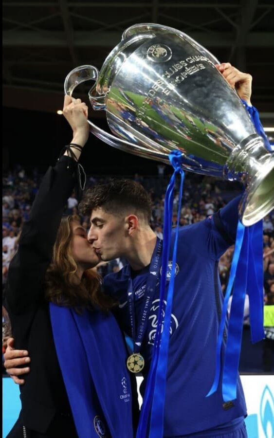 Havertz and Sophia share an emotional embrace while holding the trophy.