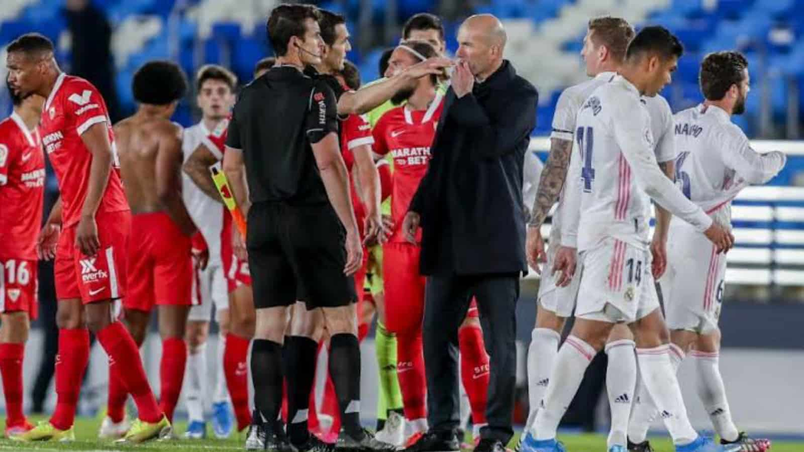 Zidane furious with the referee after a  dubious penalty was awarded to Sevilla in  2-2 draw for Real Madrid