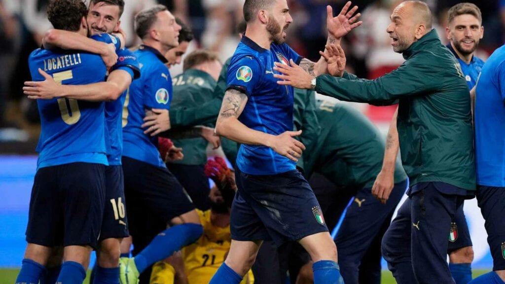 The players all jump on Donnarumma after his saves in the penalty shootout