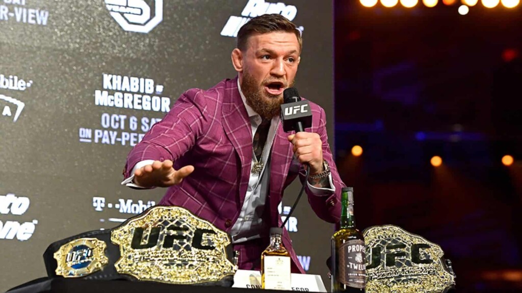 Conor McGregor with his belts