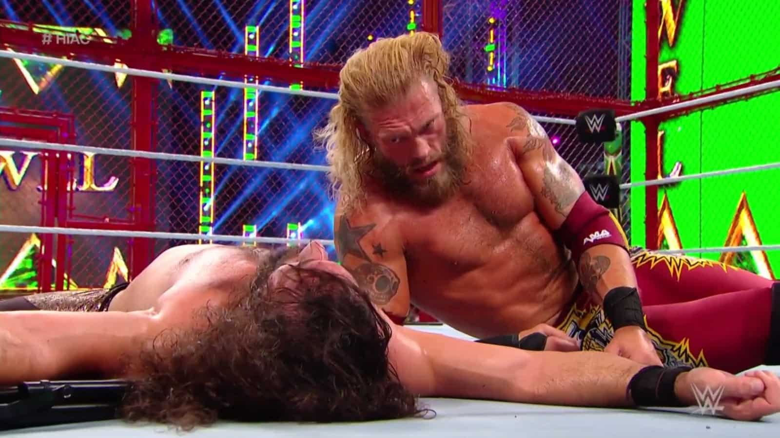 Edge stomps Seth Rollins on a steel chair to end a 7-year long rivalry at Crown Jewel 2021