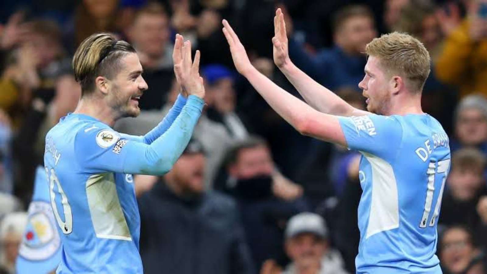 BEAUTIFUL: Manchester City’s Jack Grealish receives a Peaky Blinders gift from a young fan