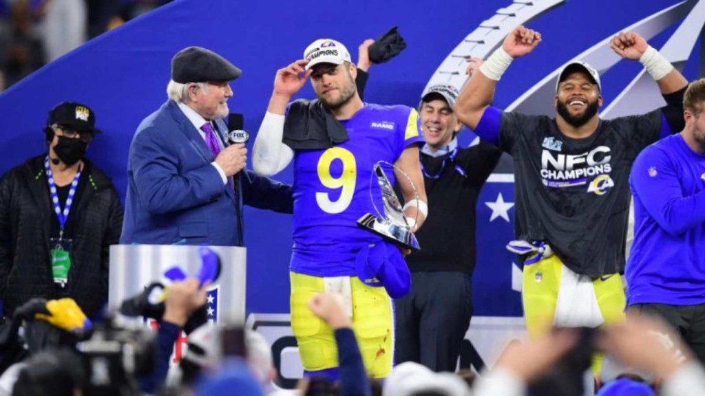 Matthew Stafford with the NFC Championship trophy