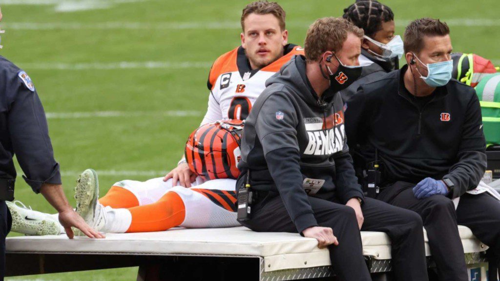 Joe Burrow being taken of f the field after injury in Week 11 last season