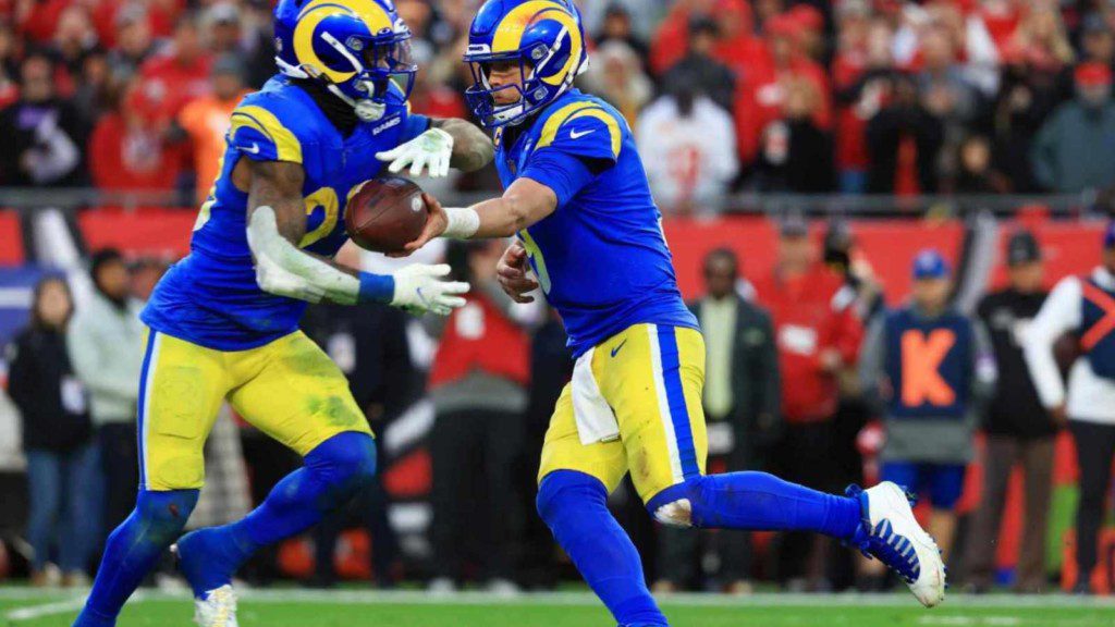 Matthew Stafford handing the ball to Cam Akers