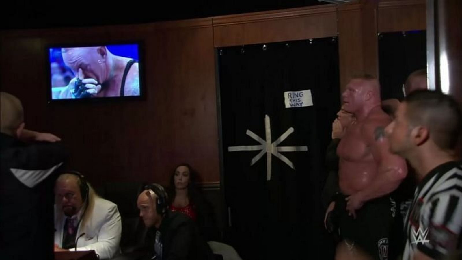 WATCH: An emotional Brock Lesnar looks at the Undertaker on TV after ending his undefeated streak at Wrestlemania 30