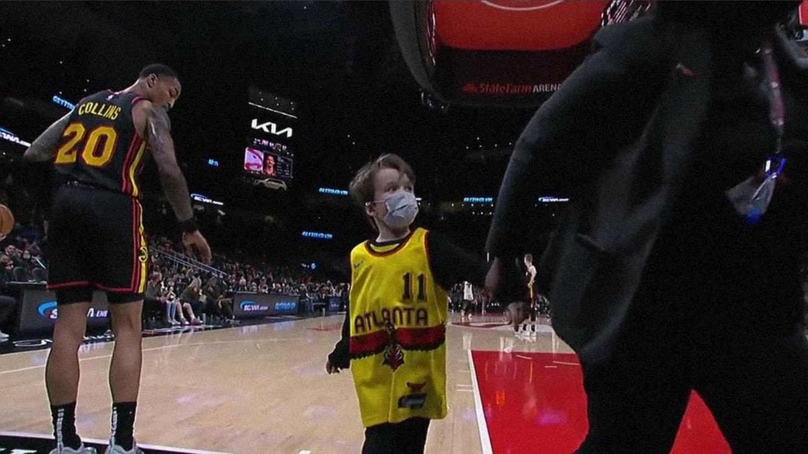 “Give that kid a jersey” Twitter awestruck by ‘little fan’ intruding the Hawks vs Heat proceedings to meet John Collins