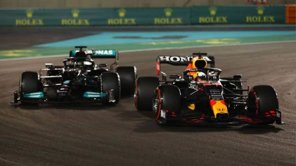 Lewis Hamilton and Max Verstappen battling it out at the Abu Dhabi Grand Prix in 2021