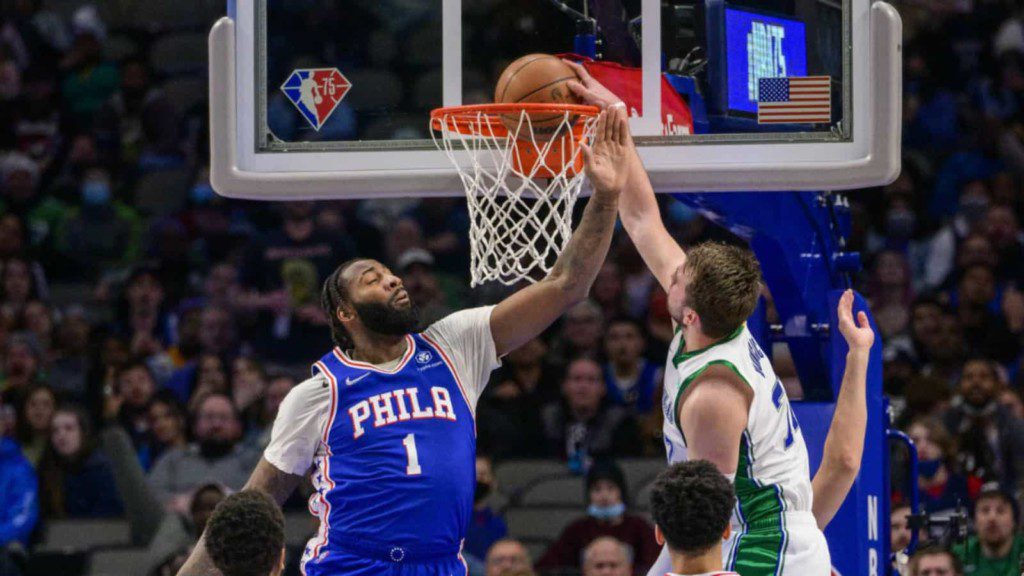 Luka Doncic dunks over Andre Drummond