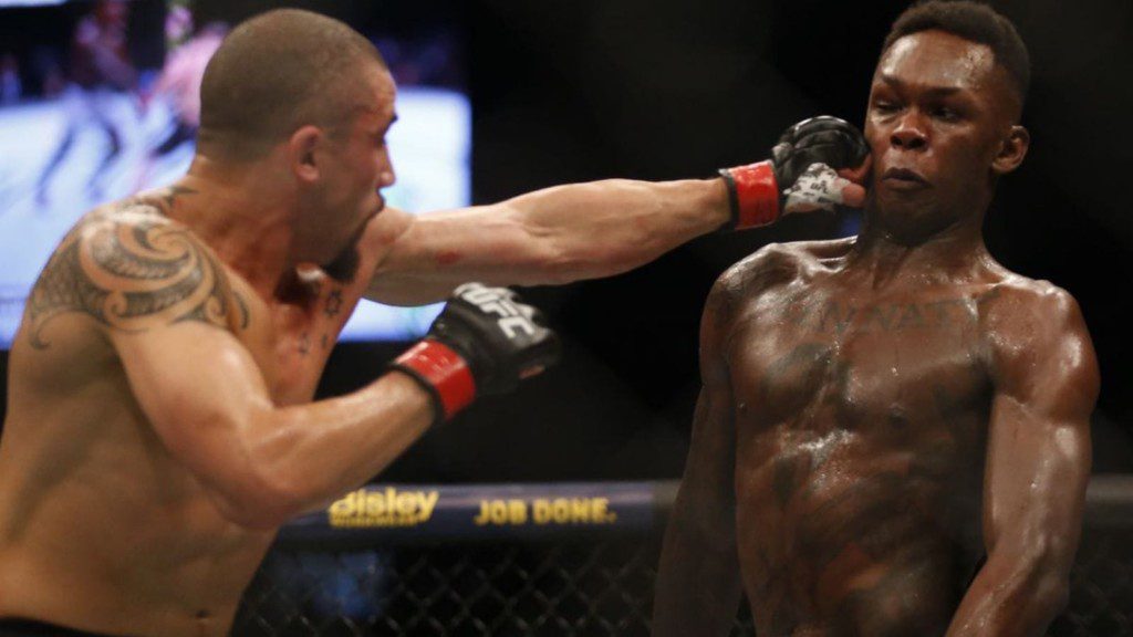 Robert Whittaker (L), Israel Adesanya(R)