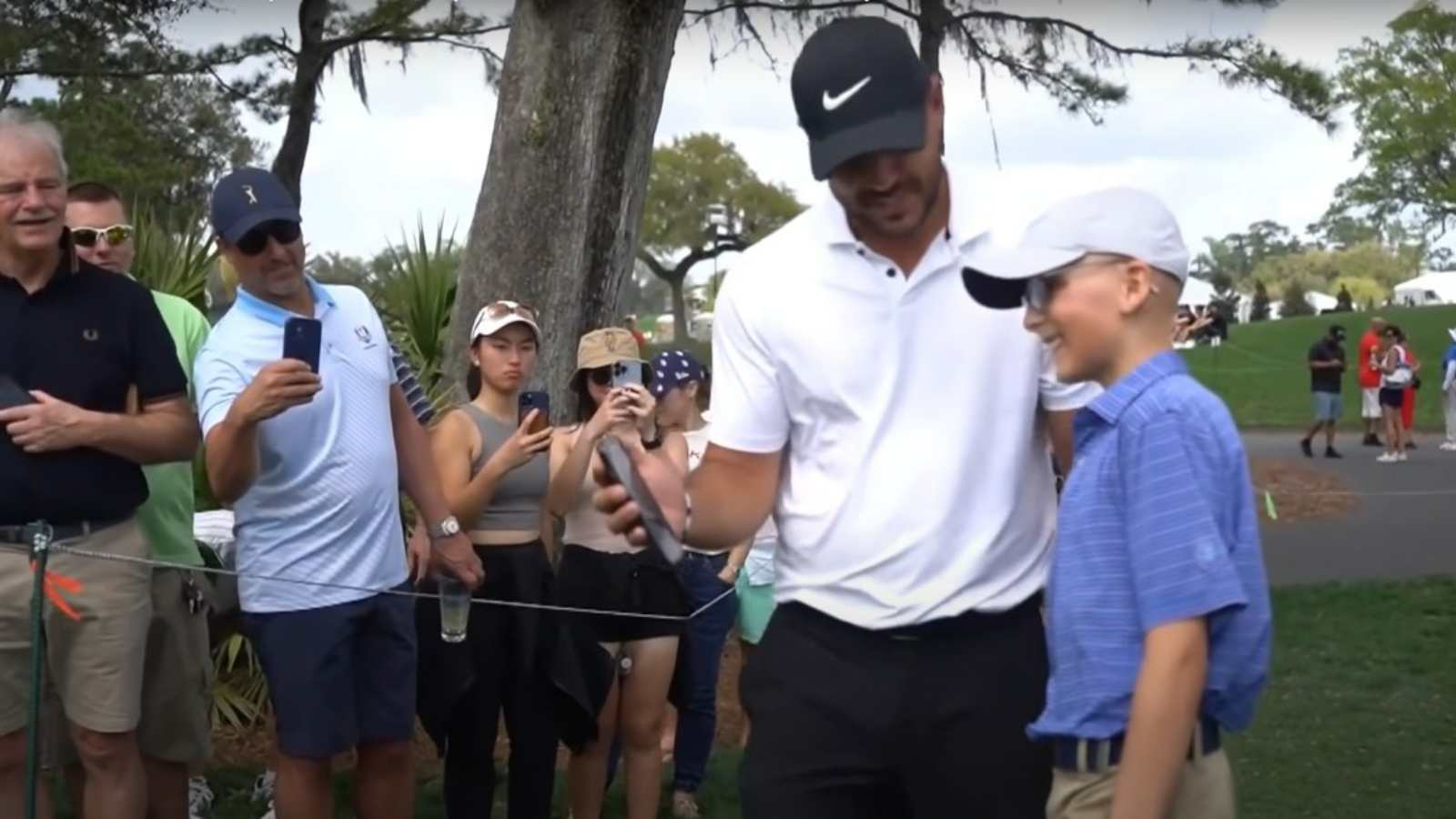 Brooks Koepka teams up with Baker Mayfield to make special day for young golf fan with rare cancer