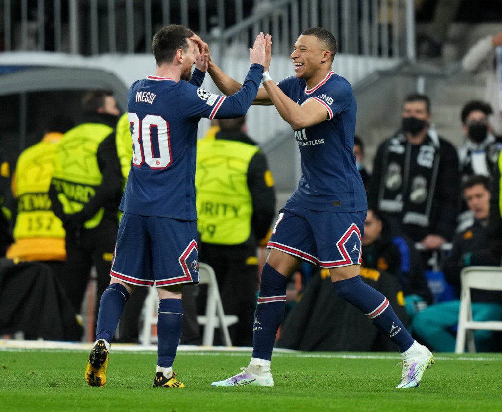 Kylian Mbappe celebrates with Messi