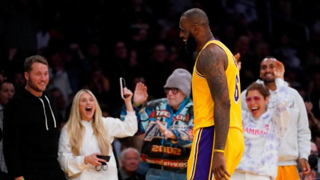 Matthew Stafford and his wife with LeBron James