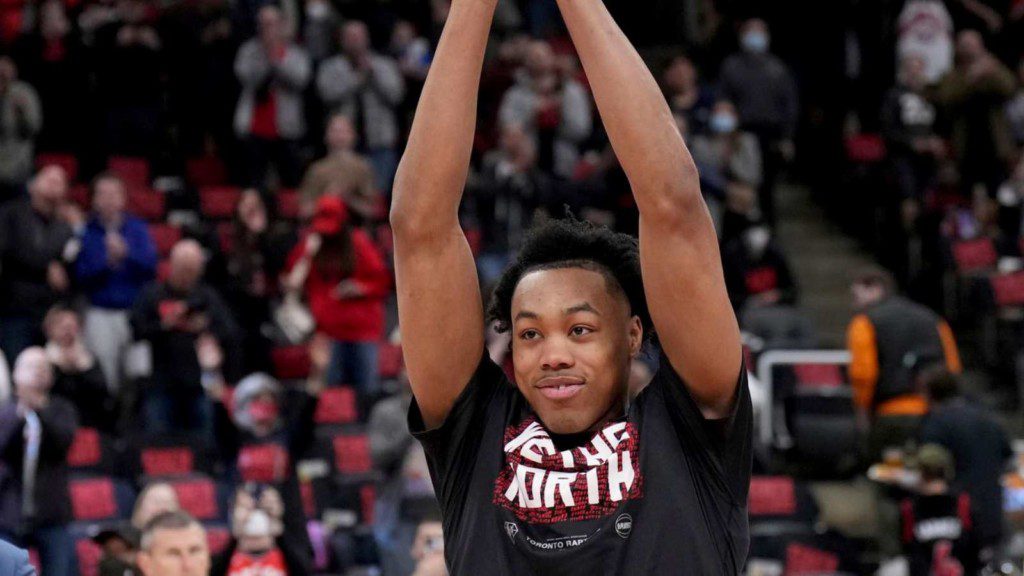 Scottie Barnes wining Rookie of the year trophy