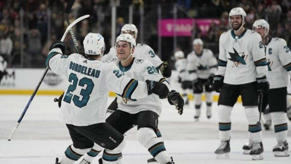 San Jose Sharks players celebrating the victory goal