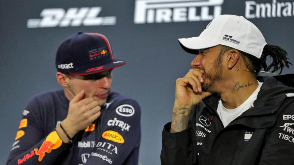 Max Verstappen and Lewis Hamilton sharing one of their rare light hearted moments