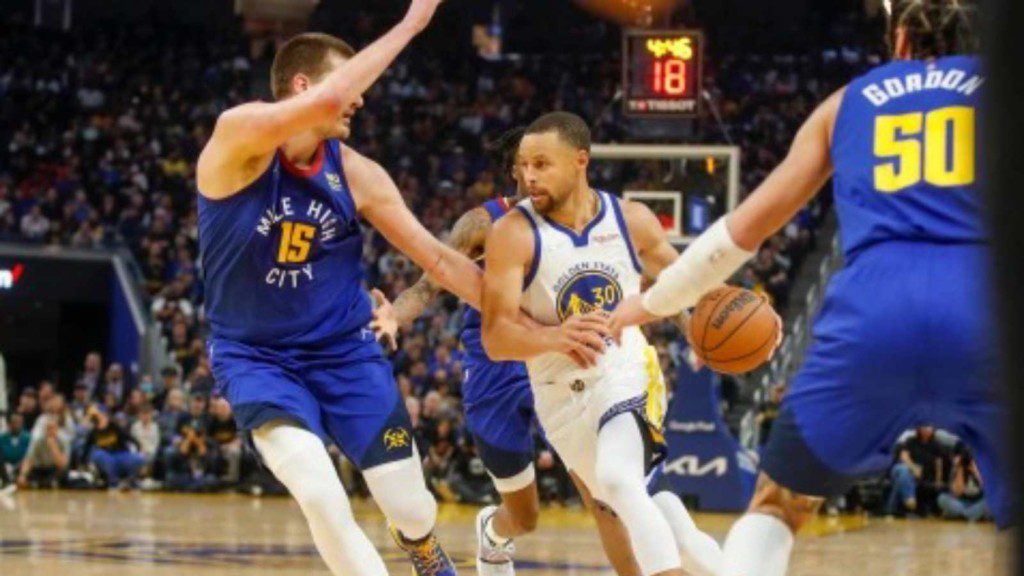 Nikola Jokic in action against the Warriors