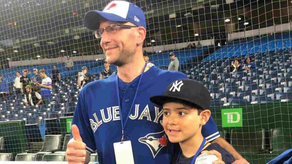 Blue Jays fan Mike Lanzillotta with young Yankees fan Derek Rodriguez