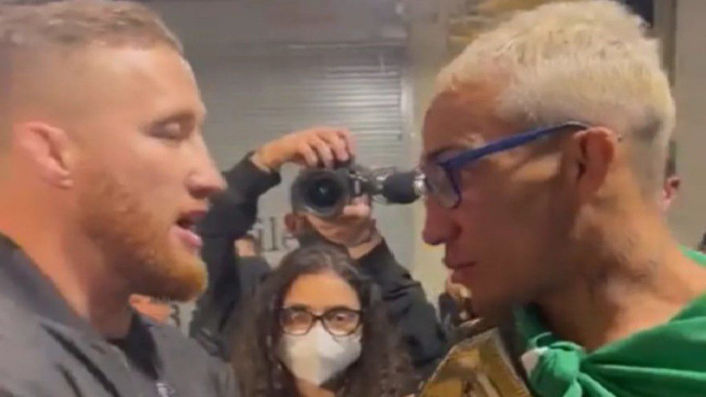 Charles Oliviera and Justin Gaethje face off  backstage at UFC 264