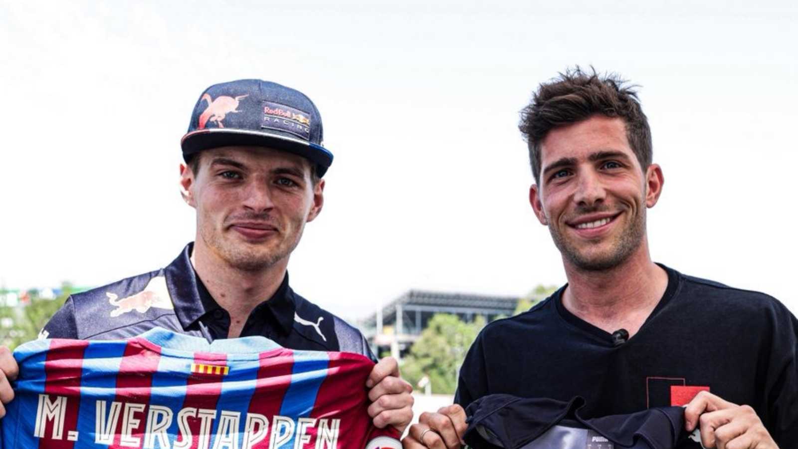 Barcelona’s Sergi Roberto and Max Verstappen exchange shirts at the 2022 Spanish Grand Prix