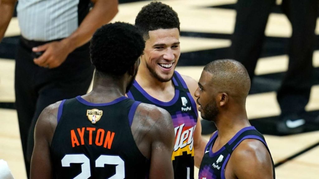 Chris Paul, Deandre Ayton and Devin Booker of Phoenix Suns