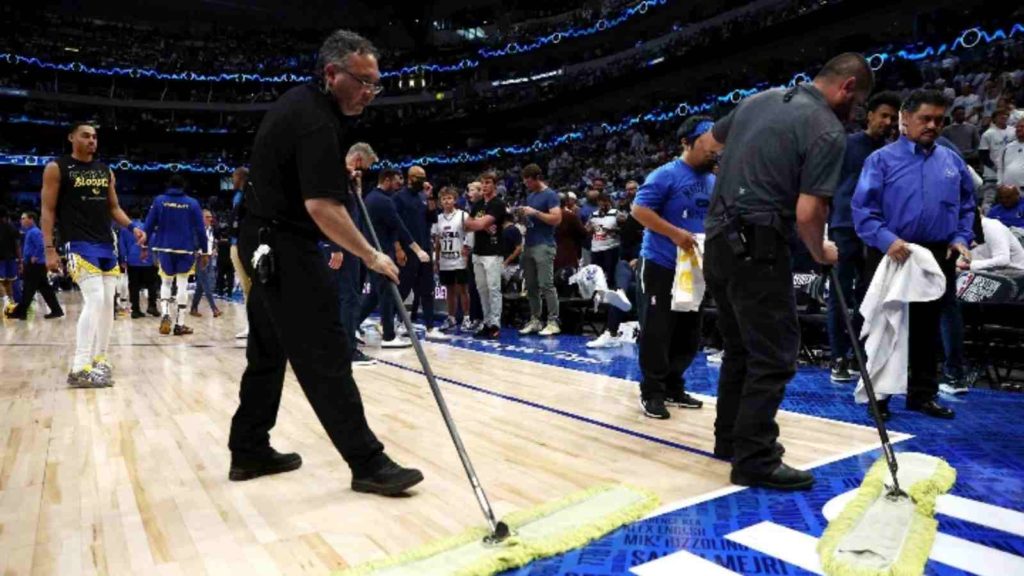 Dallas Mavericks management staff taking care of the water leak at American Airlines Center