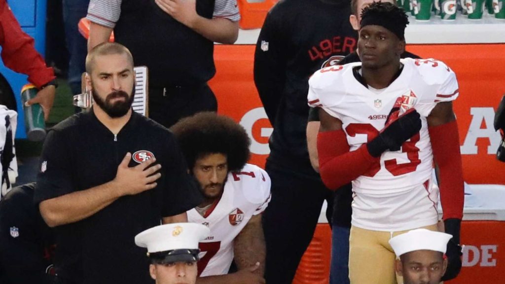 Colin Kaepernick kneeling during the national anthem