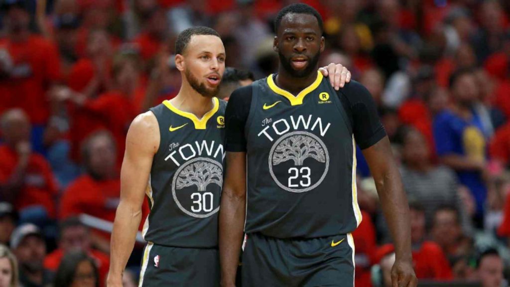 Stephen Curry suports his star forward Draymond Green