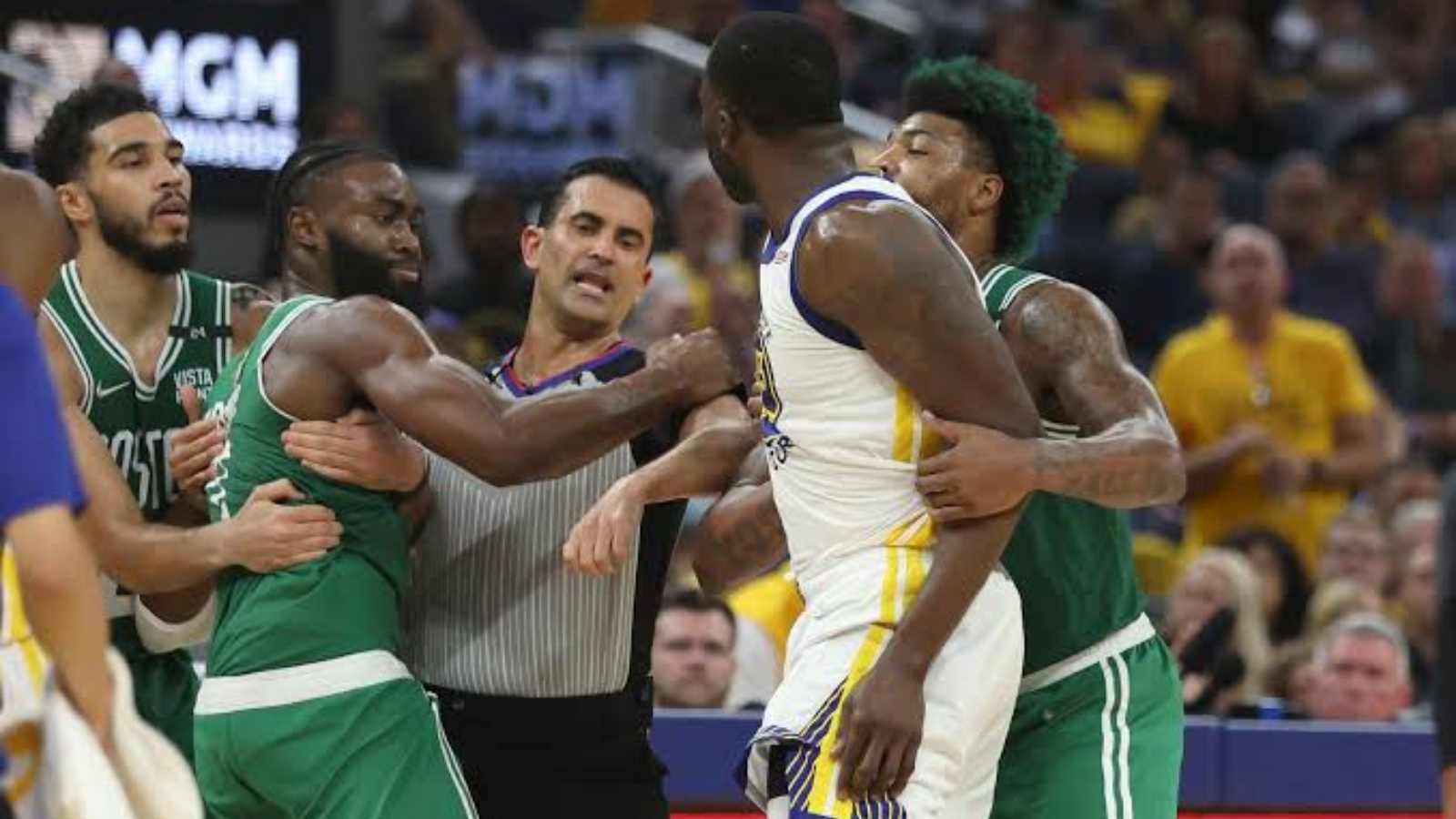 “Get off me dic*head” Jaylen Brown gets into heated exchange with Draymond Green after he wipes his shoes on Celtics’ star face