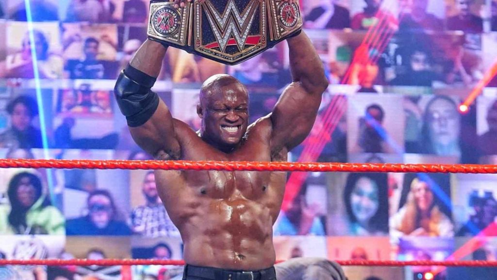 Bobby lashley posing with wwe championship belt.