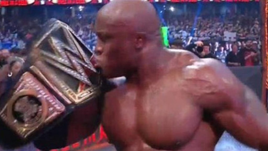 Bobby Lashley kissing the wwe championship replica