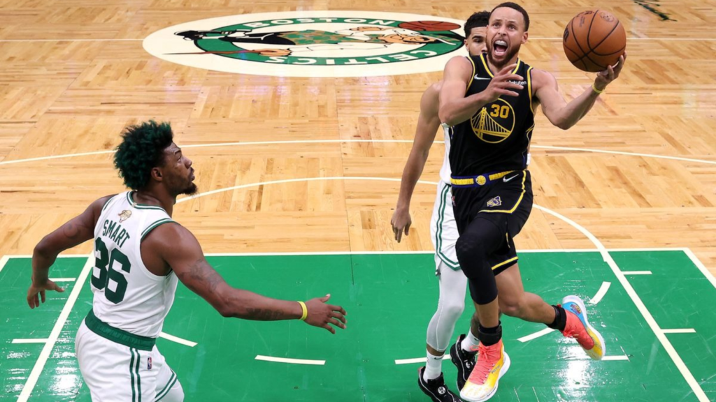 Stephen Curry attempting a layup against the Celtics