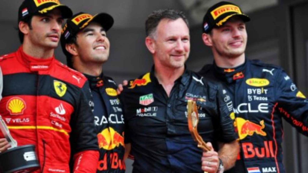 Carlos Sainz with Red Bull drivers Sergio Perez and Max Verstappen and Red Bull team principal Christian Horner