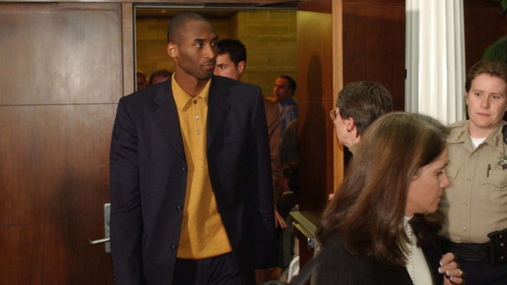 Kobe Bryant coming out of the courtroom in 2003