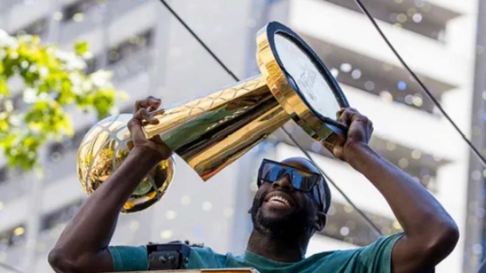 “More like free rings” NBA fans react to Draymond Green listening to Big Rings while holding the Larry O’Brien