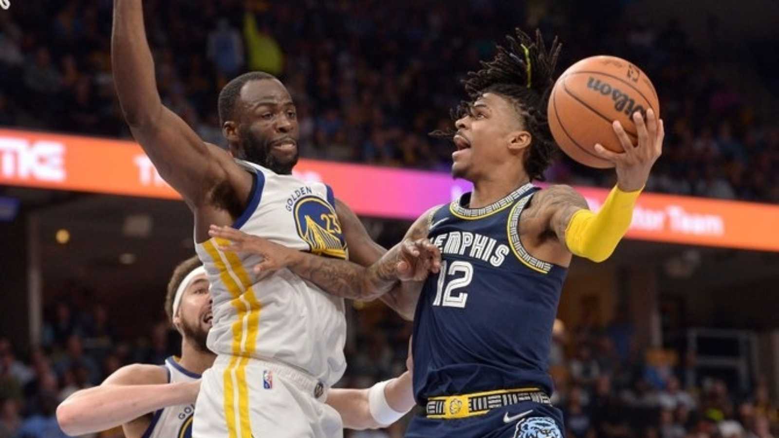 Draymond Green contests a shot of Ja Morant