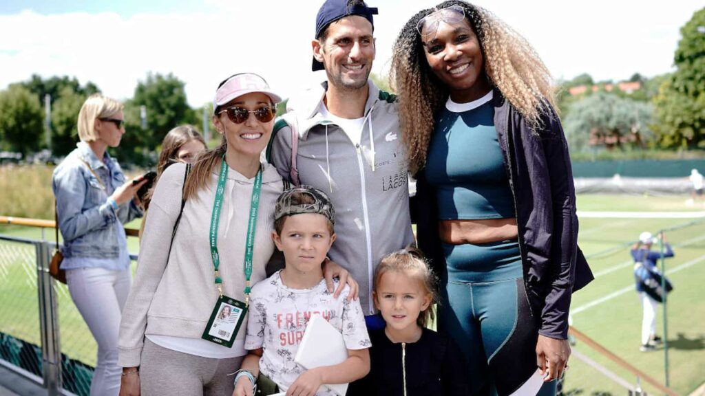 Novak Djokovic and family posing with Venus Williams