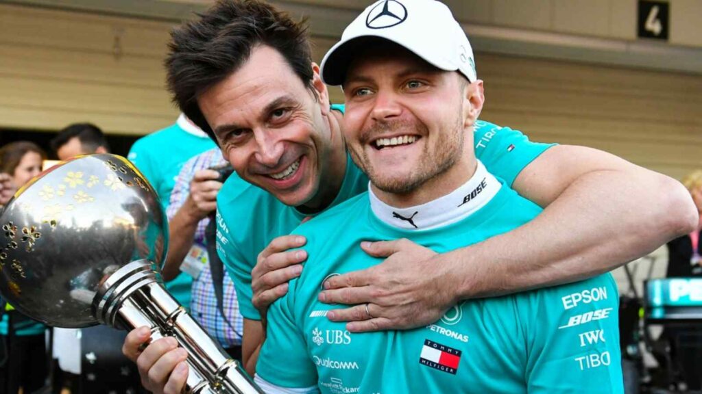 Toto Wolff (L) and Valtteri Bottas (R)