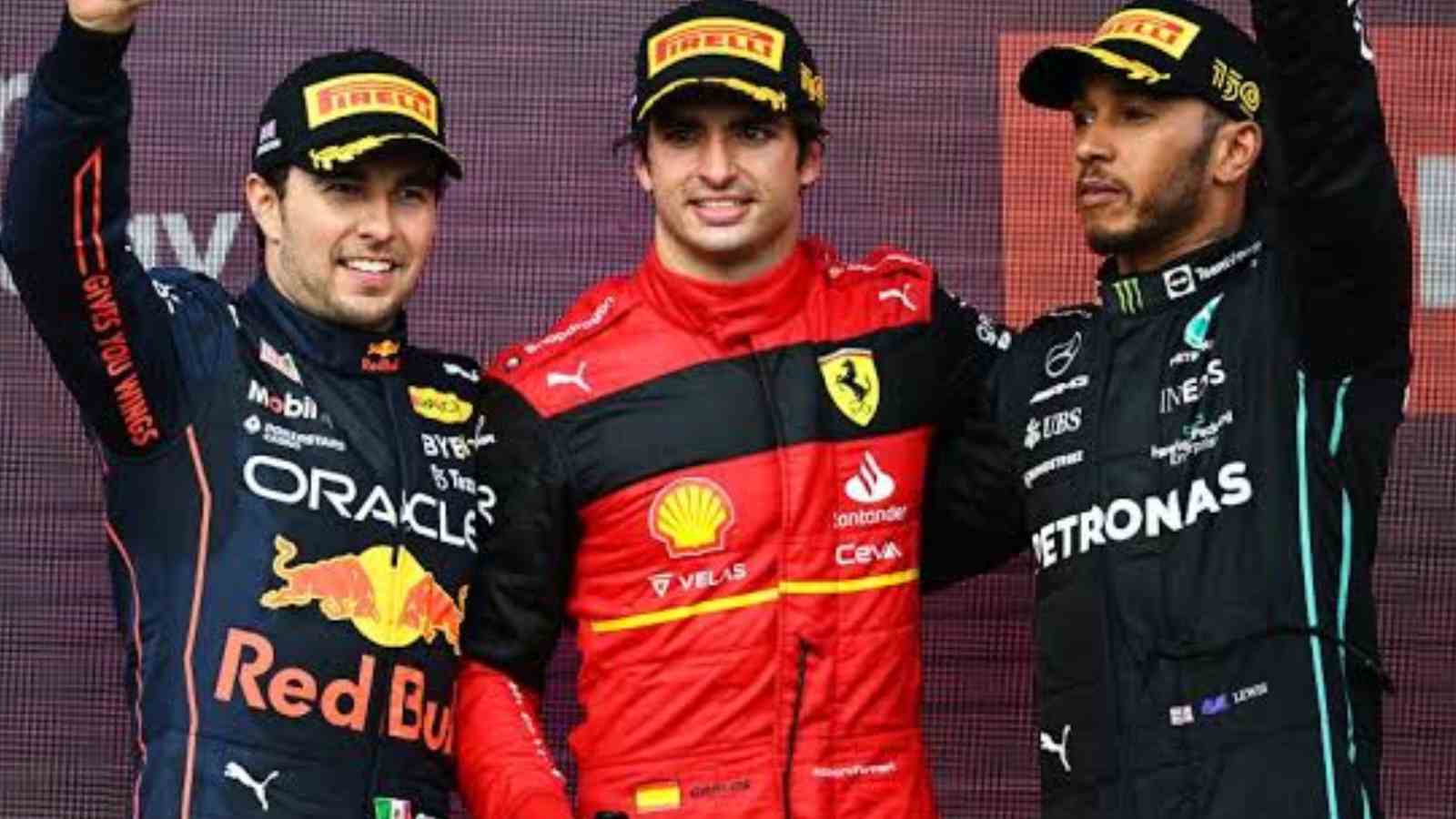 Lewis Hamilton on the podium in the British Grand Prix with Sergio Perez and Carlos Sainz