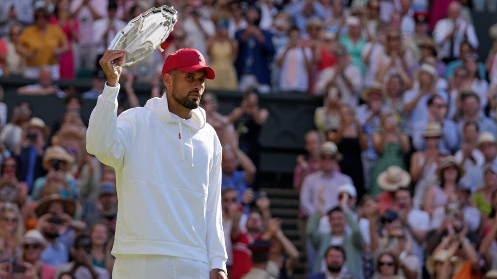 Nick Kyrgios with his 2022 Wimbledon Runner-up trophy