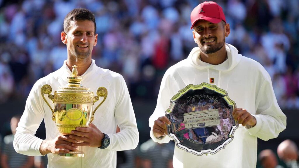 Novak Djokovic and Nick Kyrgios with their respective trophies won at Wimbledon 2022