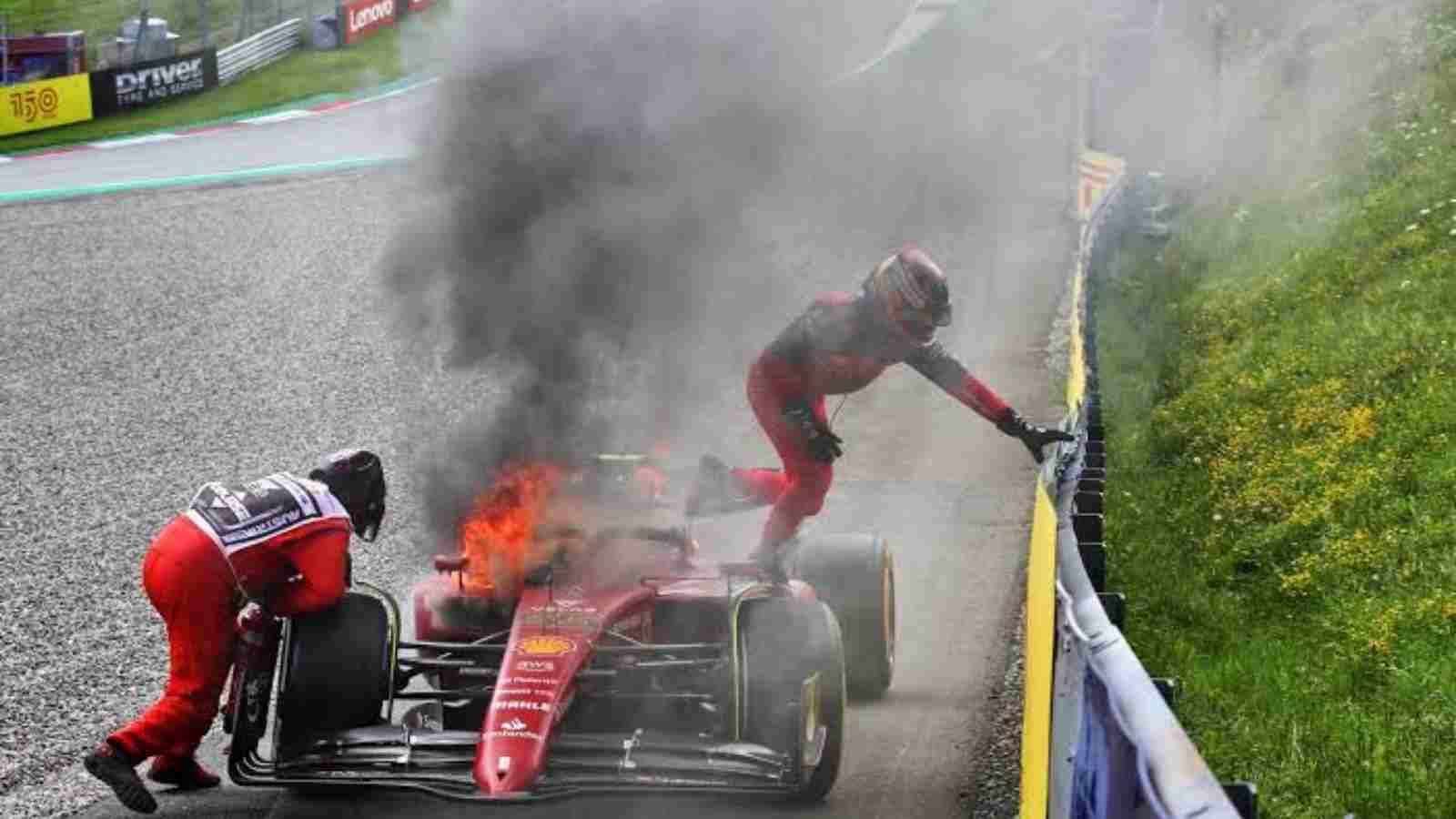 Carlos Sainz climbing out of his F1-75 in the Austrian Grand Prix following his car catching fire due to an engine issue