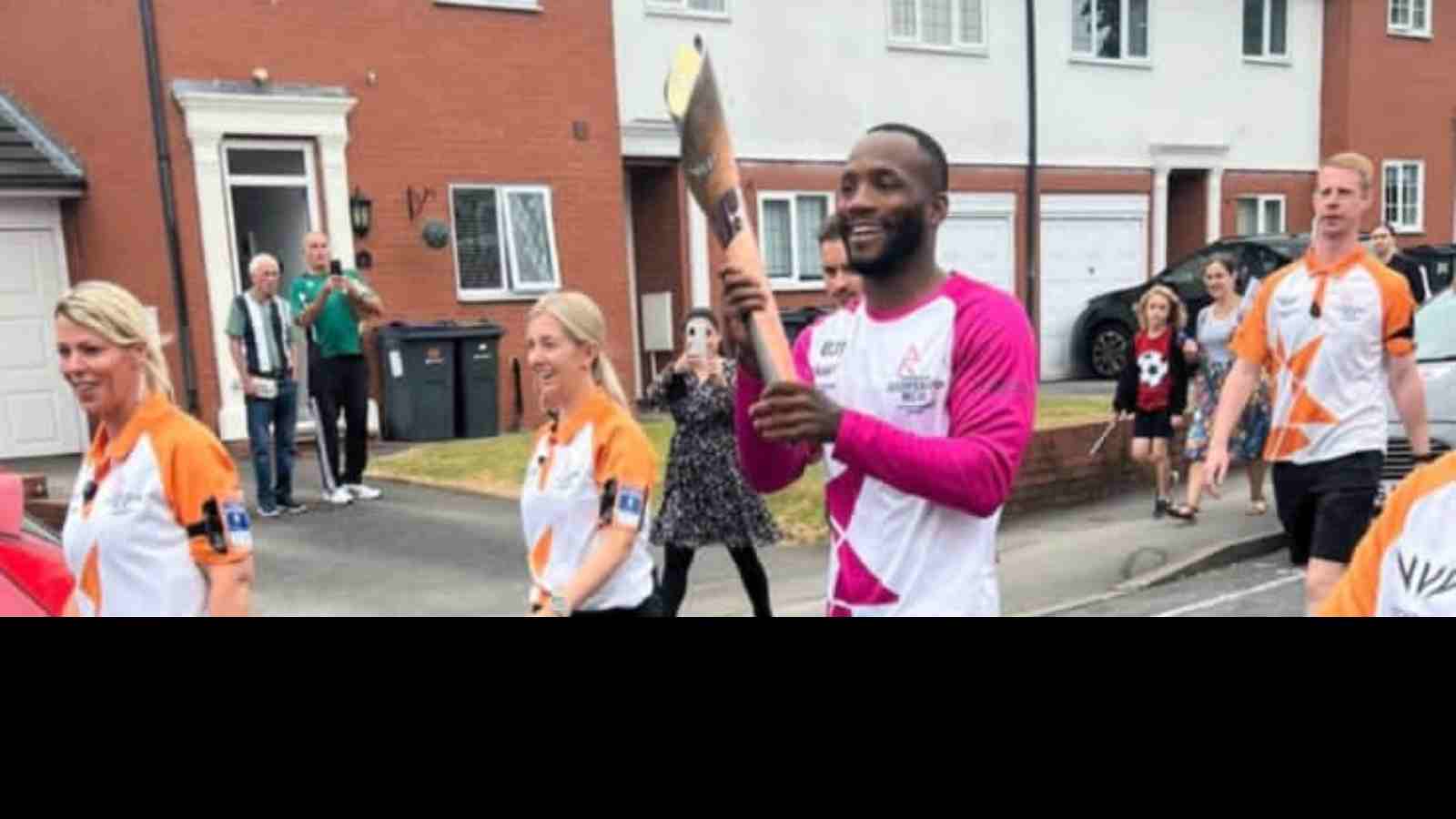 Leon Edwards carries the torch for the Commonwealth Games in his hometown of Birmingham