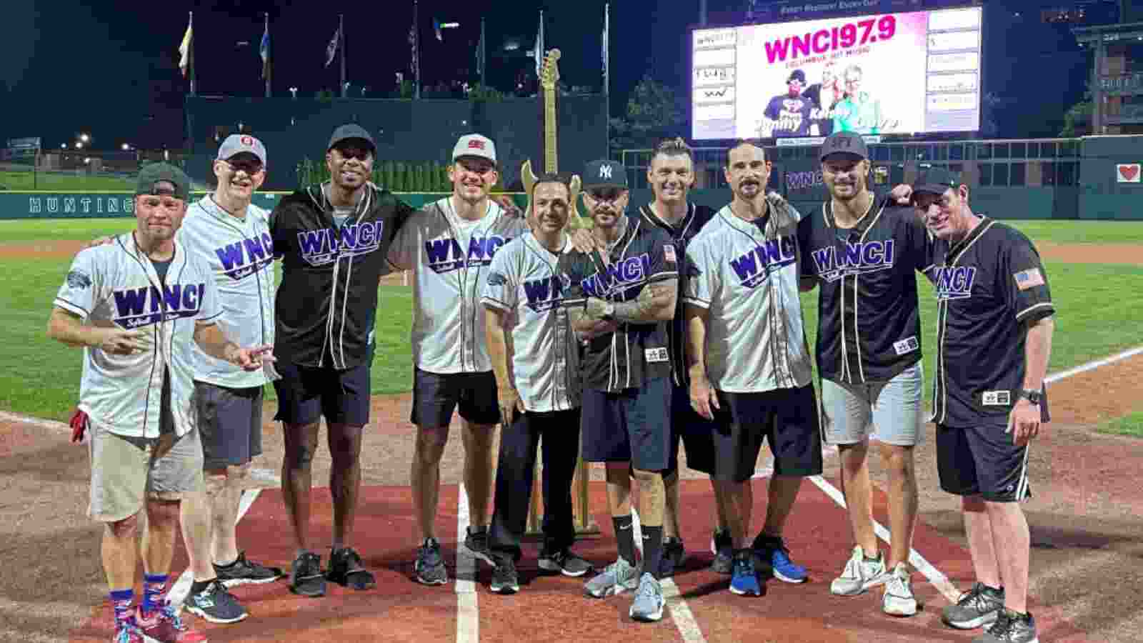 WATCH – Center Jack Roslovic and Sean Kuraly of Blue Jackets engage in softball match with Backstreet Boys at charity event