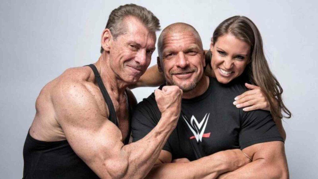 Triple H with Stephanie and Vince McMahon