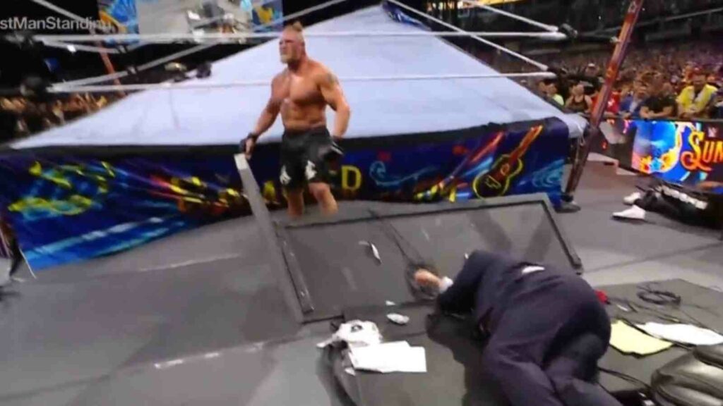  Brock Lesnar delivers an F-5 to Paul Heyman on the announcer table at SummerSlam 