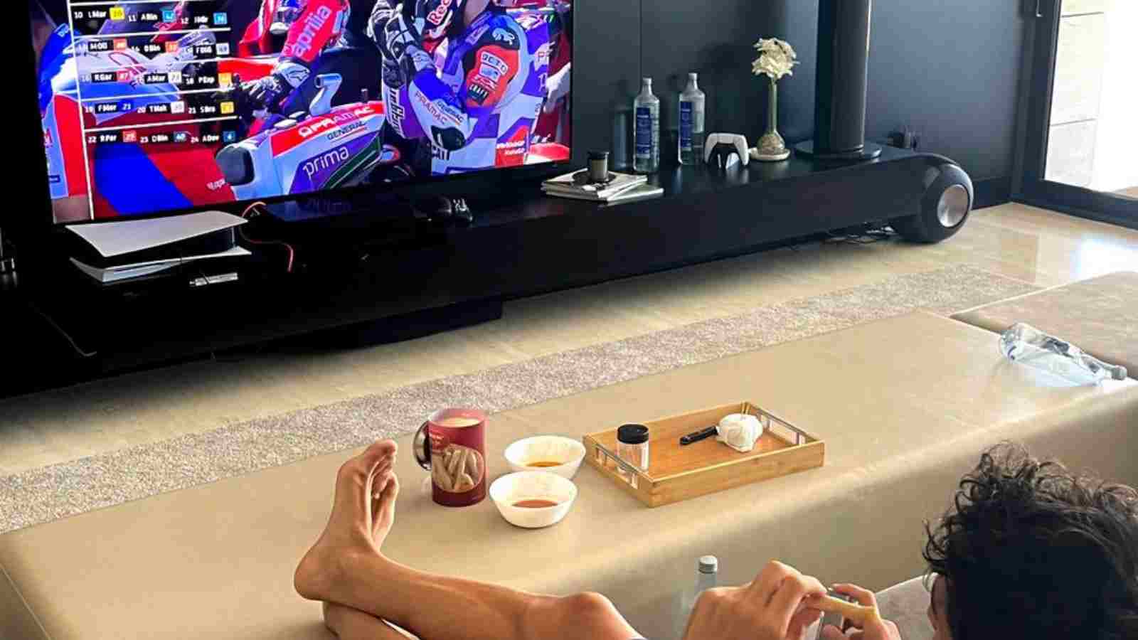 Marc Marquez enjoys MotoGP action from the comfort of his sofa