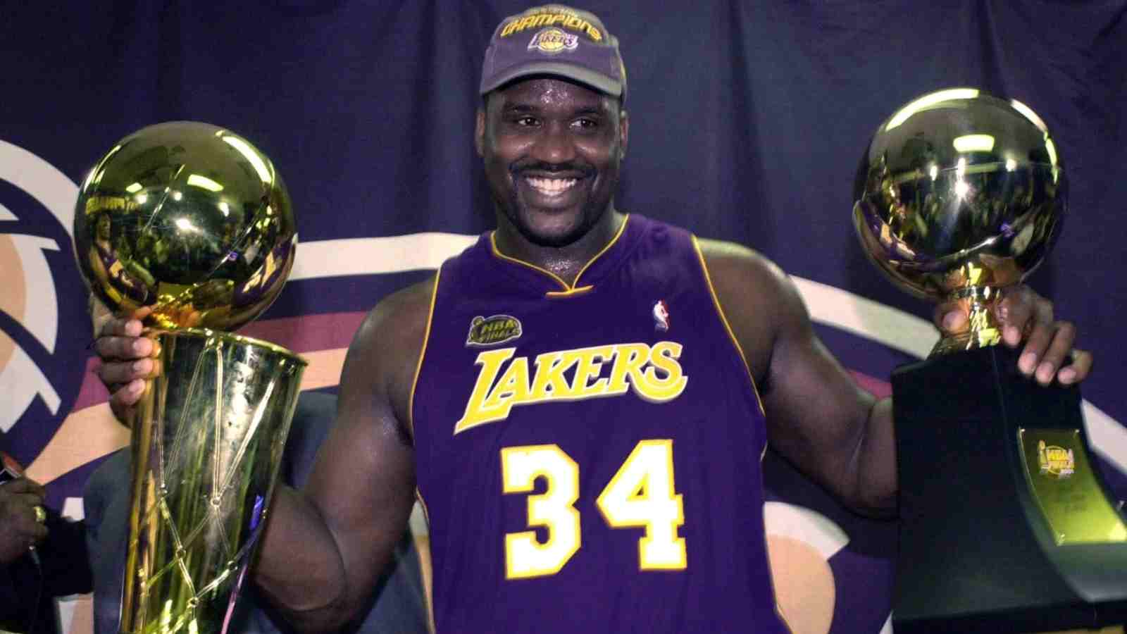 Shaquille O'Neal with his Finals trophies in 2001