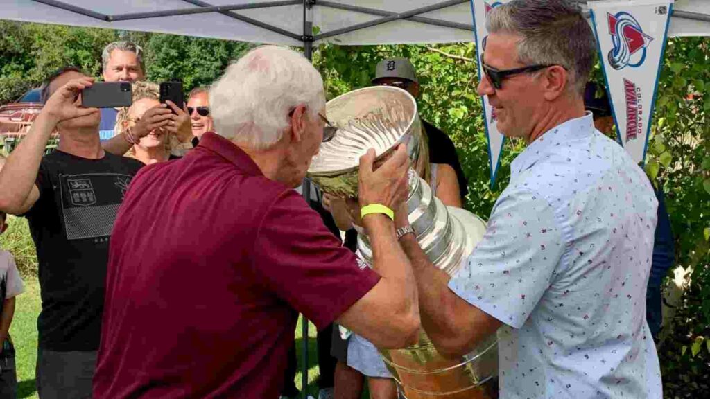 Jared Bednar's father drinks from the Stanley Cup